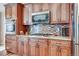 View of kitchen with stainless steel appliances and granite countertops at 4924 S Newcombe Ct, Littleton, CO 80127