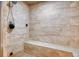 Large walk-in shower with bench and tiled walls at 4924 S Newcombe Ct, Littleton, CO 80127