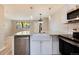 Updated kitchen with white shaker cabinets and a farmhouse sink at 3575 28Th St # 102, Boulder, CO 80301