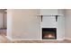 Modern electric fireplace with white shiplap surround at 3575 28Th St # 102, Boulder, CO 80301