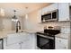 Modern kitchen with stainless steel appliances and white cabinets at 3575 28Th St # 102, Boulder, CO 80301