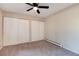 Bright bedroom with ceiling fan and ample closet space at 3575 28Th St # 102, Boulder, CO 80301