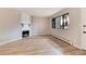 Living room with fireplace, light walls, hardwood floors at 3575 28Th St # 102, Boulder, CO 80301