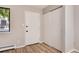 Condo entryway with coat closet and wood-look flooring at 3575 28Th St # 102, Boulder, CO 80301