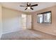 Spacious bedroom with ceiling fan and access to hallway at 3575 28Th St # 102, Boulder, CO 80301