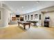 Finished basement with a pool table, game console, and ample space for recreation at 9022 Jason Ct, Boulder, CO 80303