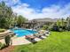 Inviting swimming pool with a waterslide and lounge chairs at 9022 Jason Ct, Boulder, CO 80303