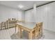 Bright and functional basement craft room with a large metal table and ample storage at 9022 Jason Ct, Boulder, CO 80303