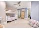 Charming basement bedroom with a bunk bed, plenty of space, and a colorful beanbag chair at 9022 Jason Ct, Boulder, CO 80303