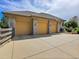 Three-car garage with stone facade and large driveway at 9022 Jason Ct, Boulder, CO 80303
