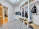 Functional mudroom with built-in storage, cubbies, and a bench for shoes at 9022 Jason Ct, Boulder, CO 80303