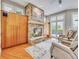 Cozy Gathering room with stone fireplace, built-ins and hardwood floors at 9022 Jason Ct, Boulder, CO 80303