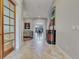 Bright and spacious entryway with elegant tile flooring and art at 9022 Jason Ct, Boulder, CO 80303