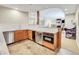 Convenient basement wet bar with granite countertop, sink, and mini-fridge at 9022 Jason Ct, Boulder, CO 80303