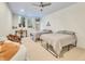 Basement bedroom with two twin beds, a desk, and access to backyard at 9022 Jason Ct, Boulder, CO 80303