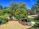 Landscaped garden with a tranquil water feature and stone seating at 9022 Jason Ct, Boulder, CO 80303