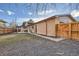 Backyard with gravel area and wooden fence at 3390 Teller St, Wheat Ridge, CO 80033