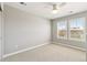 Bedroom with ceiling fan and large windows at 7032 S Waterloo Way, Aurora, CO 80016