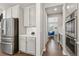 Kitchen with stainless steel appliances and walk-in pantry at 7032 S Waterloo Way, Aurora, CO 80016