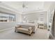 Main bedroom with plush bed, window seat, and large windows at 7032 S Waterloo Way, Aurora, CO 80016