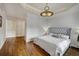 Bedroom with king-size bed and hardwood floors at 1827 N Grant St # 1000, Denver, CO 80203