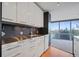 Modern kitchen with stainless steel countertops and sleek cabinetry at 3100 E Cherry Creek Drive South S Dr # 501, Denver, CO 80209