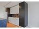 Modern kitchen with dark and white cabinetry and stainless steel appliances at 3100 E Cherry Creek Drive South S Dr # 501, Denver, CO 80209