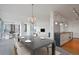 Modern dining area with a dark table, staged for dinner party at 3100 E Cherry Creek Drive South S Dr # 501, Denver, CO 80209