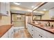 Basement bathroom with double vanity and walk-in shower at 48155 E 56Th Ave, Bennett, CO 80102