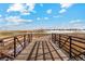 Wooden footbridge over a peaceful golf course with distant homes visible at 2131 Christina St, Fort Lupton, CO 80621