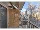 Private balcony with bamboo shade and view of trees at 4882 E Kentucky Ave # C, Denver, CO 80246