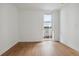 Bright and airy bedroom with wood floors and access to balcony at 3575 Chestnut Pl # 606, Denver, CO 80216