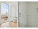 Clean bathroom with a walk-in shower and a window at 3575 Chestnut Pl # 606, Denver, CO 80216