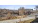 Tranquil riverfront scene with walking path and cityscape in distance at 3575 Chestnut Pl # 606, Denver, CO 80216