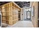 Stylish lobby with wood elevator enclosure and brick accent wall at 3575 Chestnut Pl # 606, Denver, CO 80216