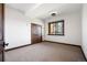 Simple bedroom with wood door and window with tree views at 22759 Mountain Spirit Way, Indian Hills, CO 80454