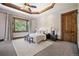 Spacious bedroom with large window and ceiling fan at 22759 Mountain Spirit Way, Indian Hills, CO 80454