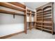 Spacious walk-in closet with custom shelving and hanging rods at 22759 Mountain Spirit Way, Indian Hills, CO 80454