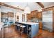 Spacious kitchen with custom cabinetry, large island and breakfast area with views at 22759 Mountain Spirit Way, Indian Hills, CO 80454