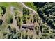 House with a large, circular driveway and trees at 22759 Mountain Spirit Way, Indian Hills, CO 80454