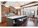 Modern kitchen with an expansive island, custom cabinetry and breakfast nook at 22759 Mountain Spirit Way, Indian Hills, CO 80454