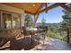 Deck with mountain views and outdoor dining furniture at 22759 Mountain Spirit Way, Indian Hills, CO 80454