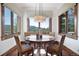 Bright breakfast nook with scenic views and copper table at 22759 Mountain Spirit Way, Indian Hills, CO 80454