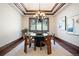 Elegant dining room with chandelier and hardwood floors at 22759 Mountain Spirit Way, Indian Hills, CO 80454