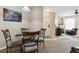 Small dining area with granite table and four chairs at 5703 N Gibralter Way # 204, Aurora, CO 80019