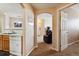 Hallway view of living room with recliner and access to bedrooms at 5703 N Gibralter Way # 204, Aurora, CO 80019