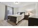 Basement bedroom with a full-size bed at 8382 W Nichols Ave, Littleton, CO 80128