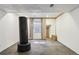 Basement gym with a free standing heavy bag and large mirror at 8382 W Nichols Ave, Littleton, CO 80128