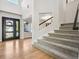 Bright entryway with hardwood floors and staircase at 8382 W Nichols Ave, Littleton, CO 80128