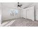 Bright bedroom with neutral walls, carpet, and a window at 9909 W 99Th Ave, Broomfield, CO 80021